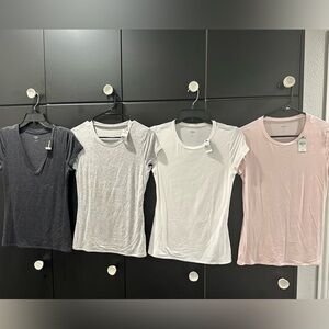NWT Express fitted t shirts. Size M. Lot of 4. White, Black, Grey, Light Pink.